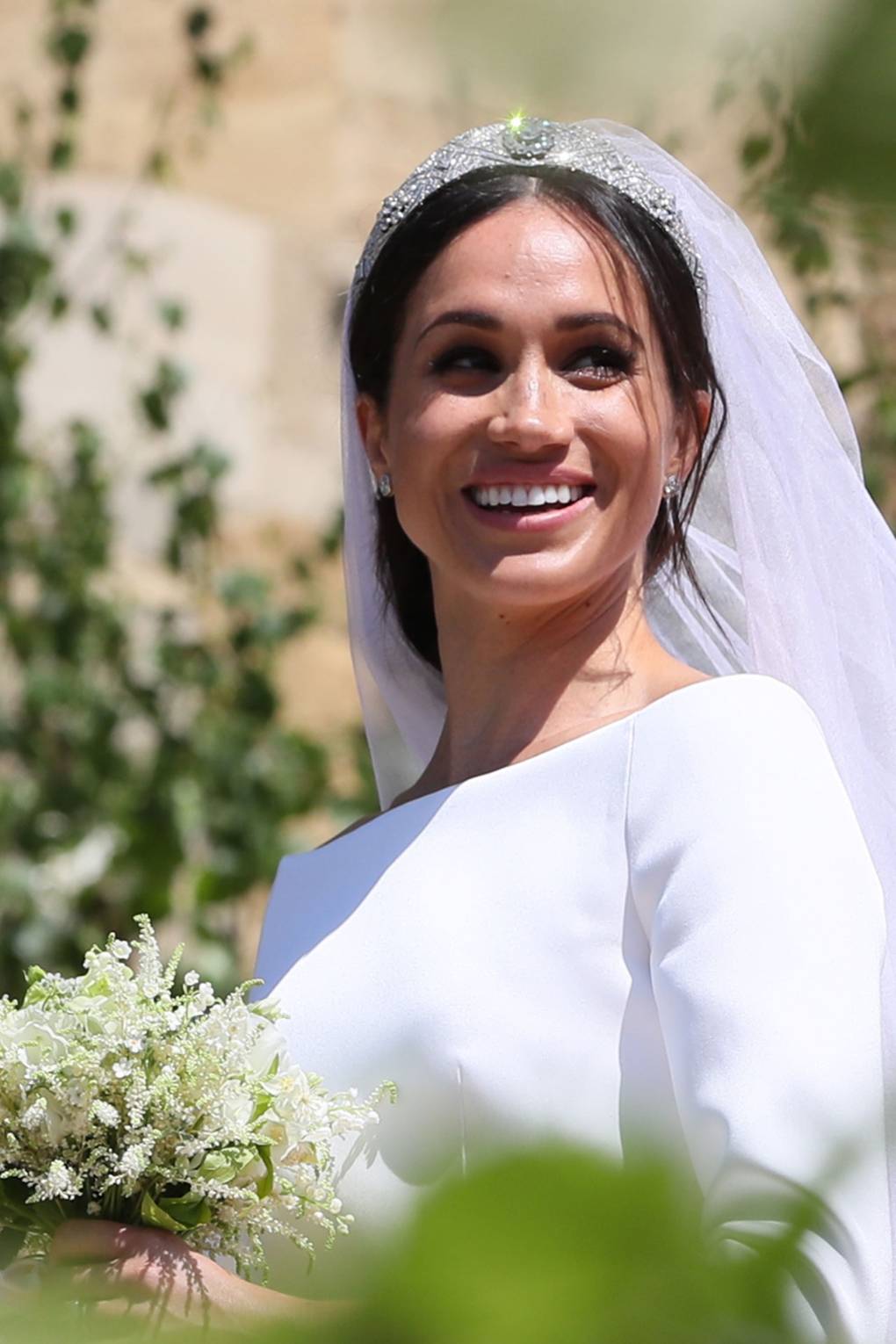 Close up of Meghan Markle's wedding dress and tiara in the sunshine