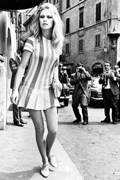 Brigitte Bardot Style Fashion Icon British Vogue 1970 Wearing A Short Striped Drop Waisted Dress She Was Pursued By The Paparazzi As Left Forum Hotel In Rome