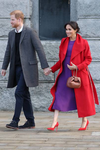 In a bold red and purple combination on a royal visit to Birkenhead in January

Getty Images